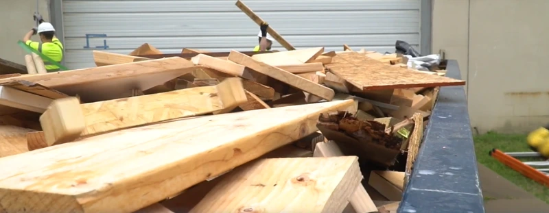 a  dumpster art roofing jobsite