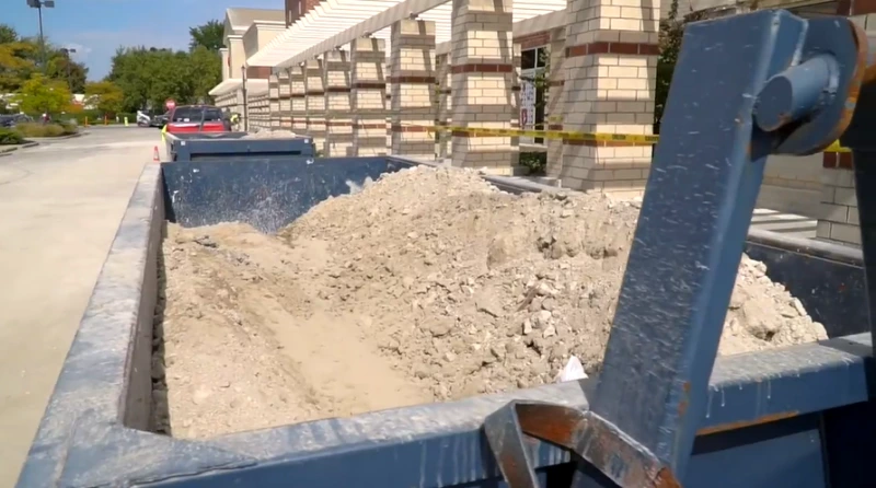 Commercial roll-off dumpster for retail renovation debris