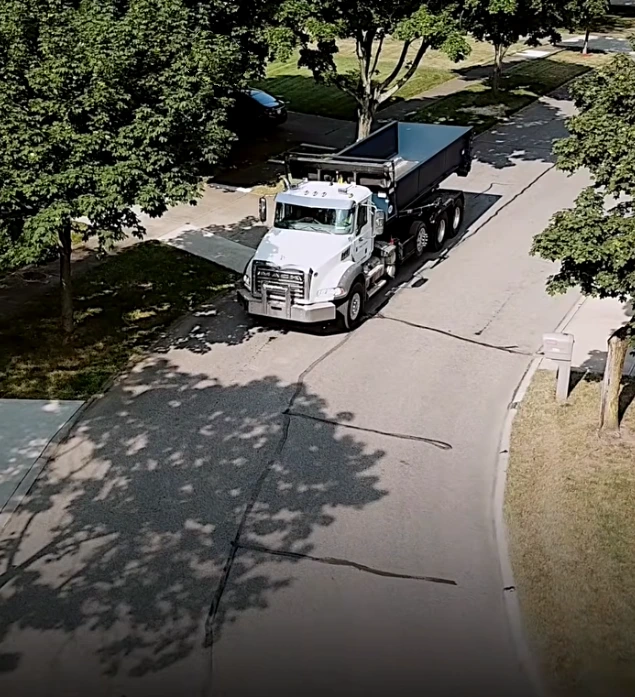 12-yard roll-off dumpster positioned on a residential driveway